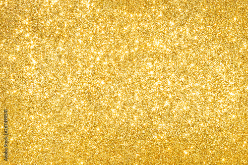 sparkles of golden glitter abstract background	