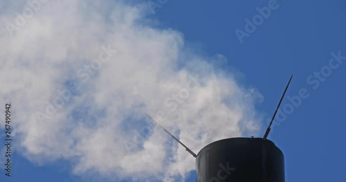 Smoke and air pollution from a chimney in France. photo