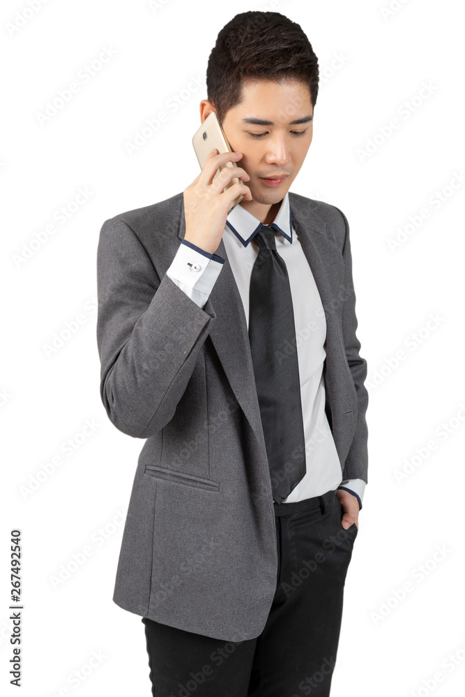 Happy young businessman working with smartphone in suit looking at camera on white background, isolated concept Happy young businessman working with smartphone in suit looking at camera on white background, isolated concept