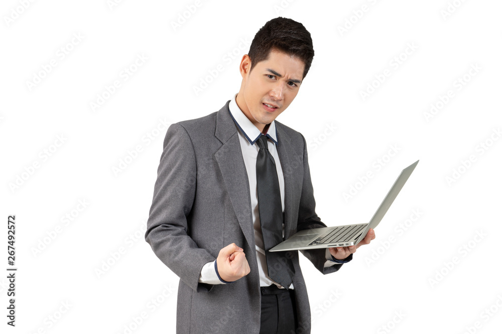 Happy young businessman standing arm up and hold laptop in suit on white background, isolated concept Happy young businessman standing arm up and hold laptop in suit on white background, isolated concept