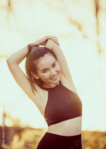 Wallpaper Mural Health, sport and workout concept - Young Asian woman warm up body before jogging and workout daily. Female runner does stretching body to warm up before exercise. Torontodigital.ca