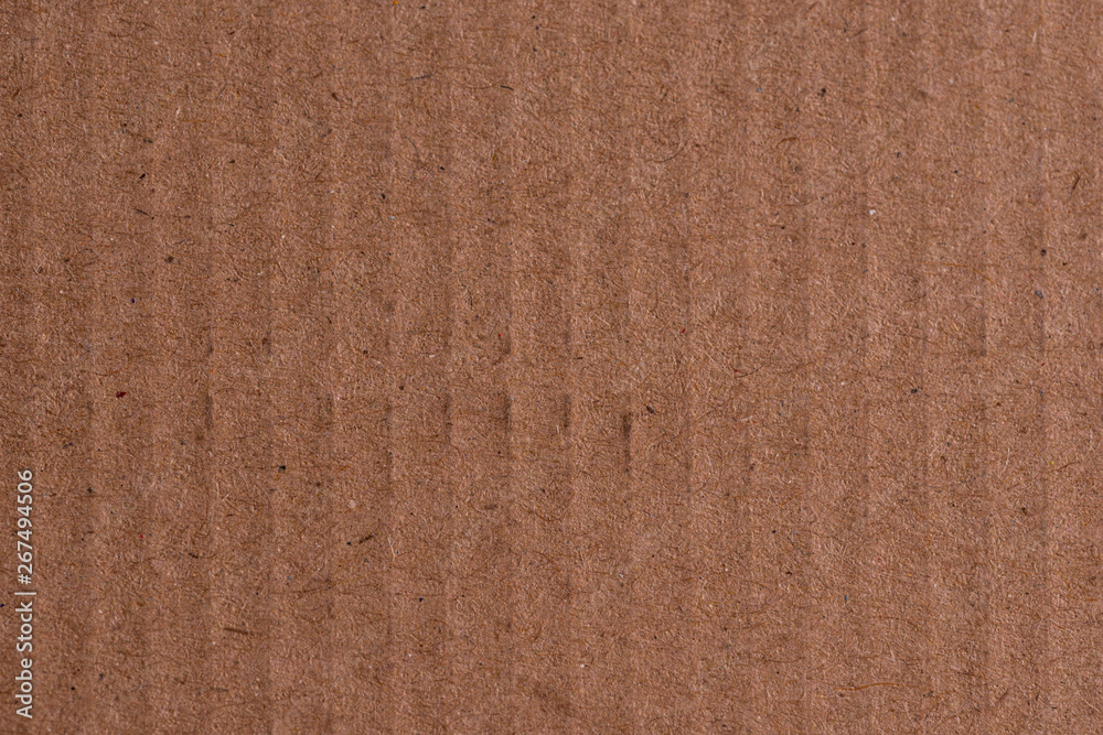 Fototapeta premium Brown cardboard sheet of paper, abstract texture