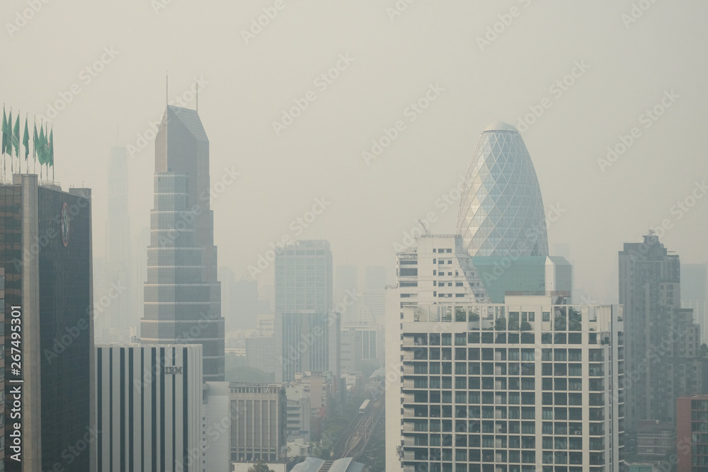 Smog covers the buildings, the sky that are seriously overcast for public health, air pollution with PM2.5 air quality index (AQI) reaching dust and danger level