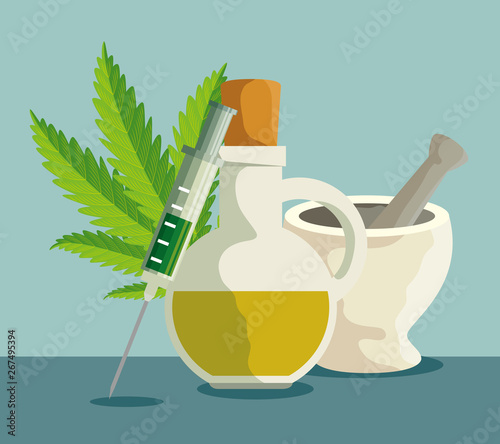 cannabis oil in the jar with stone grinding crusher and syringe
