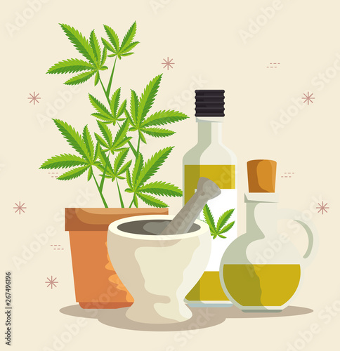 nature cannabis plants oil in the bottles and stone grinding crusher
