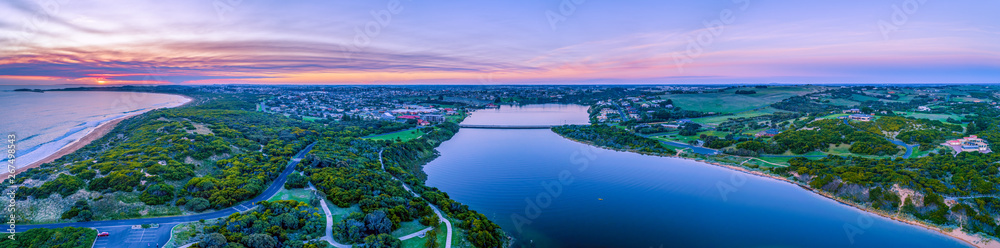 Wide aerial panorama of Hopkins River and Warrnambool at sunset in Victoria, Australia