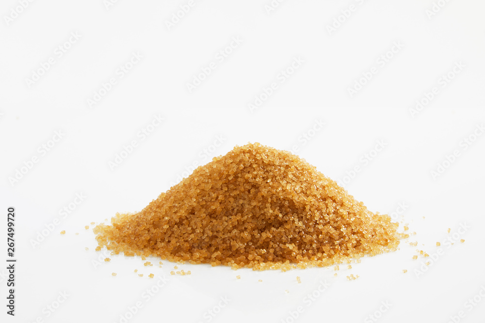 Pile of brown sugar from sugar cane reed, Sucrose sugar white background Pile of brown sugar from sugar cane reed, Sucrose sugar white background