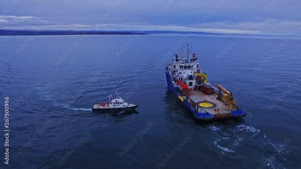 Aerial scene of Ship-trailer in the sea with water launch. Aerial plane of the horizontal orbit. Beautiful blue sea. Aerial scene of Ship-trailer in the sea with water launch. Aerial plane of the horizontal orbit. Beautiful blue sea.