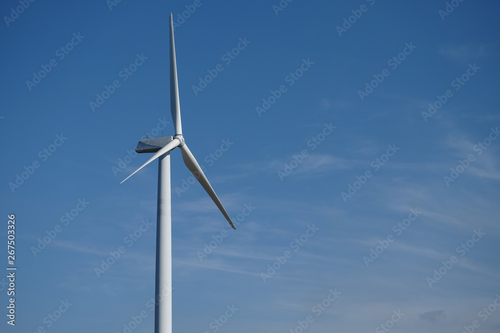 A wind turbine is a device that converts the wind's kinetic energy into electrical energy. A wind turbine is a device that converts the wind's kinetic energy into electrical energy.
