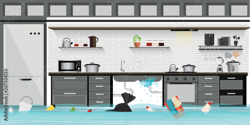 Interior flooded basement flooring of kitchen with leaky pipeline.