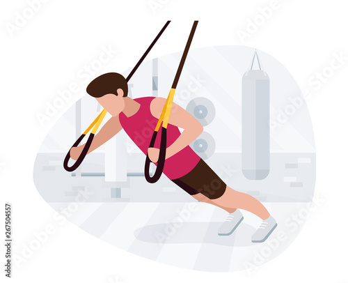 Fit man working out on trx doing bodyweight exercises. Fitness strength training workout.