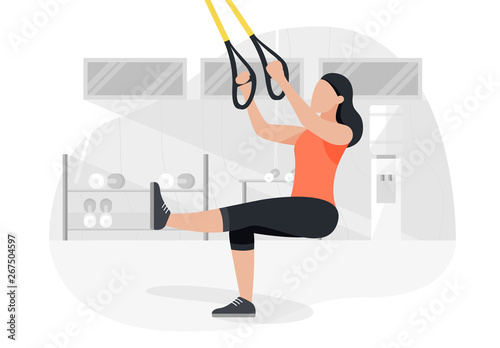 Fit woman working out on trx doing bodyweight exercises. Fitness strength training workout.