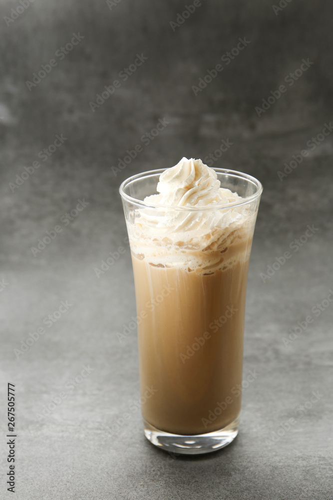 ice Viennese coffee in a glass on a grey background ice Viennese coffee in a glass on a grey background