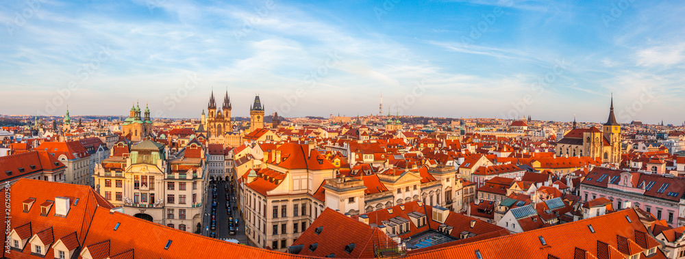 Panorama of warm evening light falling on Prague from above