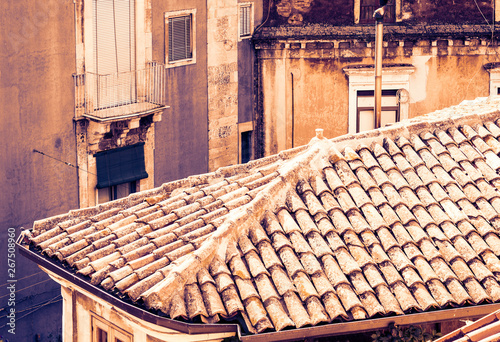 Sicily sunset with Catania rooftops, aerial cityscape.