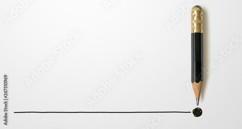 Black colour pencil with outline to end point on white paper background. Creativity inspiration ideas concept photo
