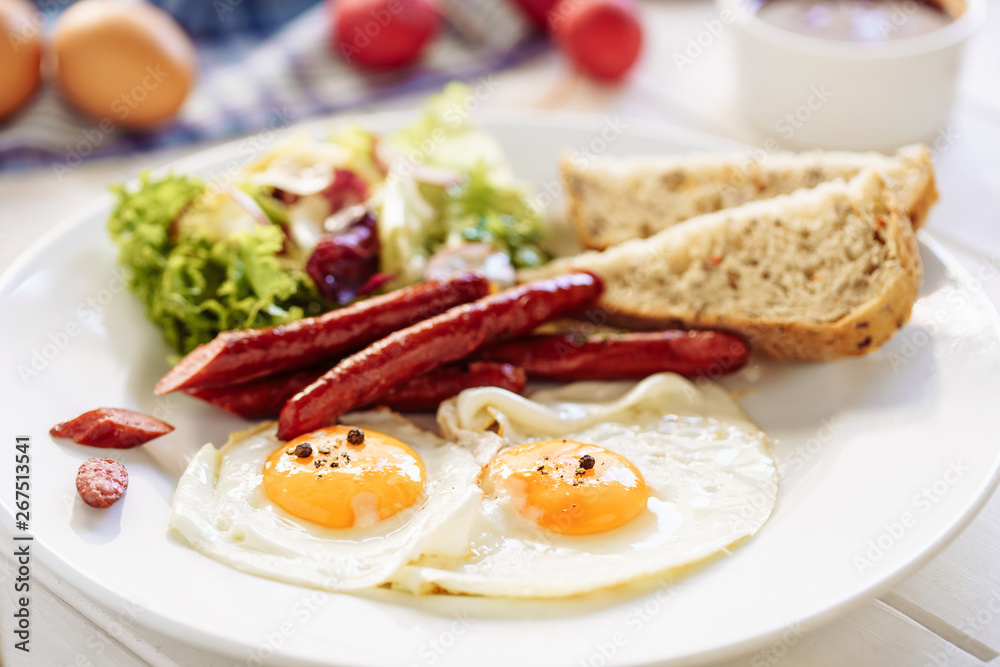 Egg Sausage Breakfast with Toast Salad White Plate. Fried American Meal with Smoked Hunting Ham Side View. Delicious English Lunch. Tasty Home Cooked Gourmet Closeup. Eat Brunch Egg Sausage Breakfast with Toast Salad White Plate. Fried American Meal with Smoked Hunting Ham Side View. Delicious English Lunch. Tasty Home Cooked Gourmet Closeup. Eat Brunch