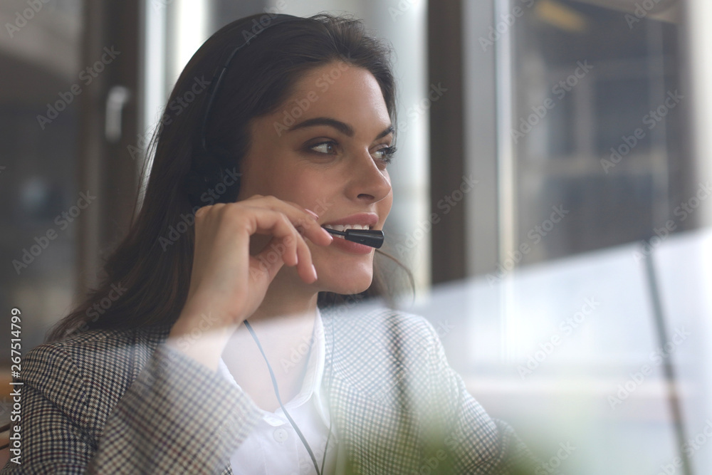 Woman customer support operator with headset and smiling. Woman customer support operator with headset and smiling.