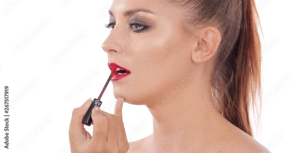 Beautiful woman makeup her face at white background. People with beauty, makeup, health care concept. Beautiful woman makeup her face at white background. People with beauty, makeup, health care concept.