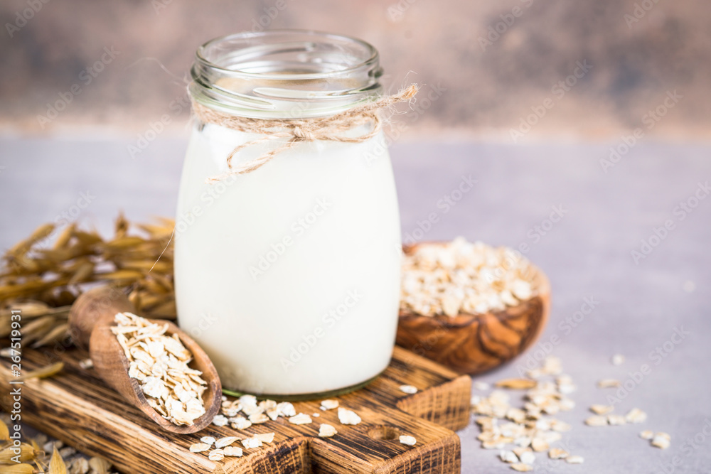 Vegan oat milk, non dairy alternative milk.  - obrazy, fototapety, plakaty 