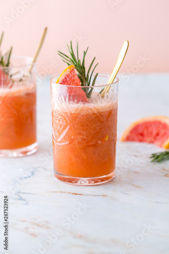 Grapefruit cocktail or mocktail on marble table top