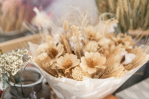 bouquet of dried flowers. Still life with wheat ears and yellow wildflowers.