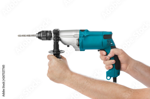 Electric drill in hands