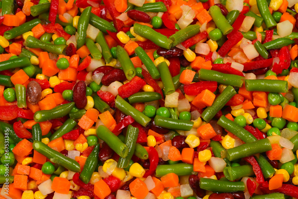 Sliced vegetables, corn, beans, peas, carrots, sweet peppers background. Sliced vegetables, corn, beans, peas, carrots, sweet peppers background.