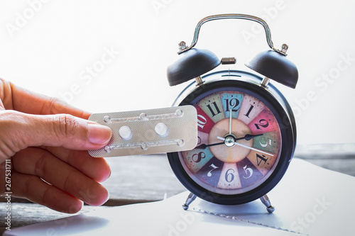 holding emergency birth control pills. oral contraception.