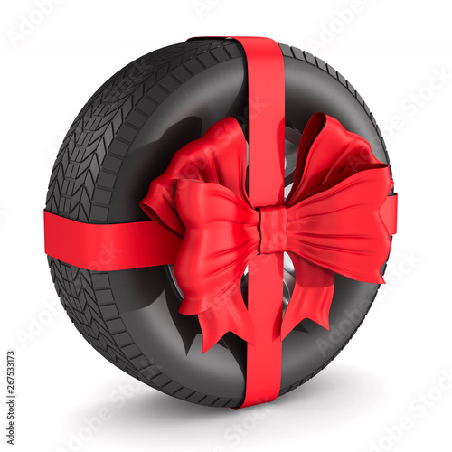 tire with red bow on white ...