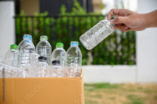 man hand putting plastic reuse for recycling concept environmental protection world recycle