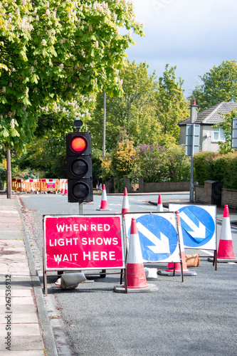 A sight to frustrate every driver - temporary traffic lights at red holding up your journey just as you are in a hurry