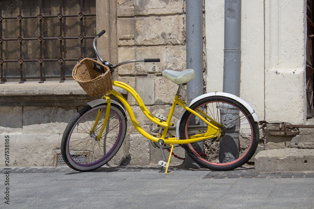 yellow retro bike,The streets of the old city are retro ladies bike