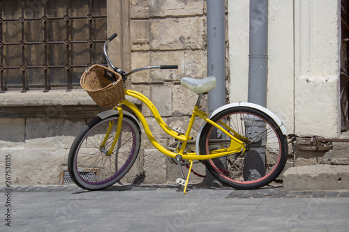 yellow retro bike,The streets of the old city are retro ladies bike © retbool