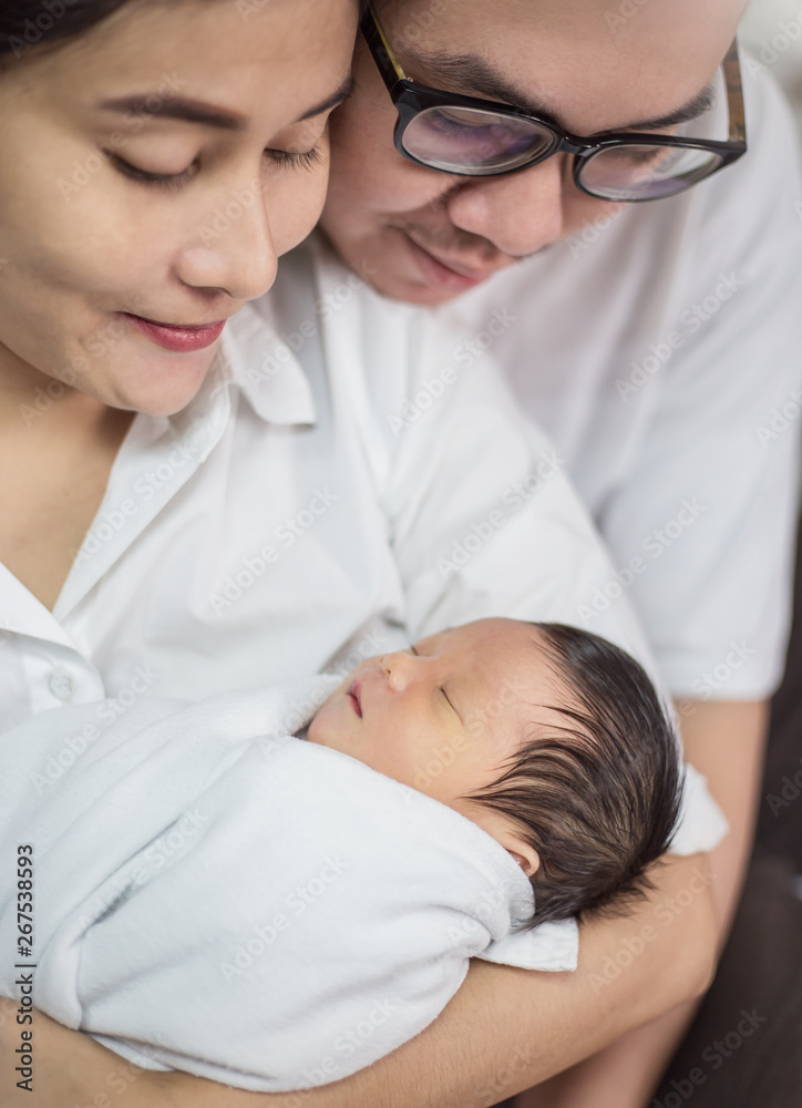 Asian parents with newborn baby, Close up portrait of asian young