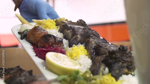 Iranian food served at a restaurant, slow motion photo