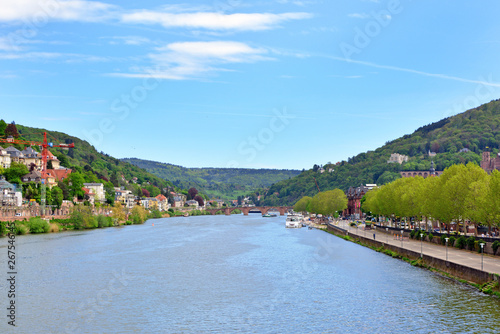 View over Neckar river with old historical buildings and Odenwald Mountain range over Heidelberg in Germany in early spring