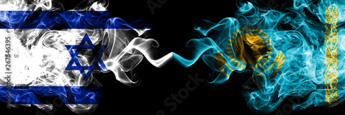 Israel vs Kazakhstan, Kazakhstani smoky mystic flags placed side by side. Thick colored silky smokes flag of Israel and Kazakhstan, Kazakhstani