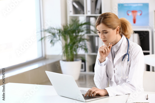 Beautiful gynecologist working in her office © Pixel-Shot