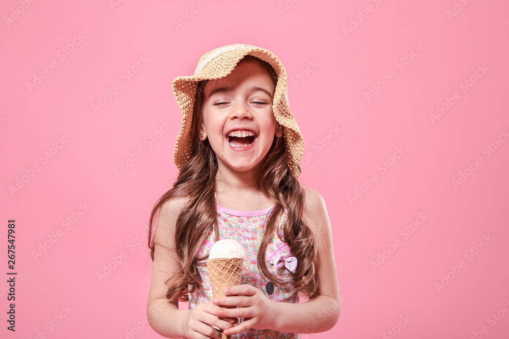 Portrait of a little cheerful girl with ice cream on a colored background Portrait of a little cheerful girl with ice cream on a colored background