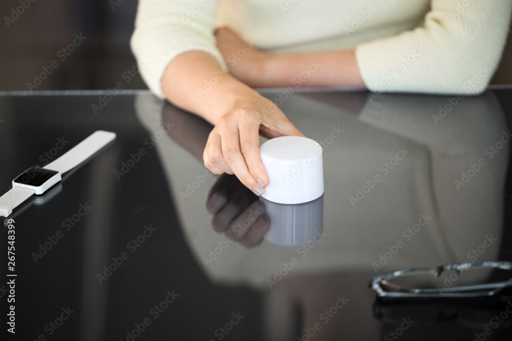 technology and people concept - close up of woman using smart speaker on black interactive panel technology and people concept - close up of woman using smart speaker on black interactive panel