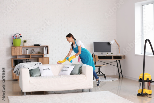 Female janitor cleaning flat