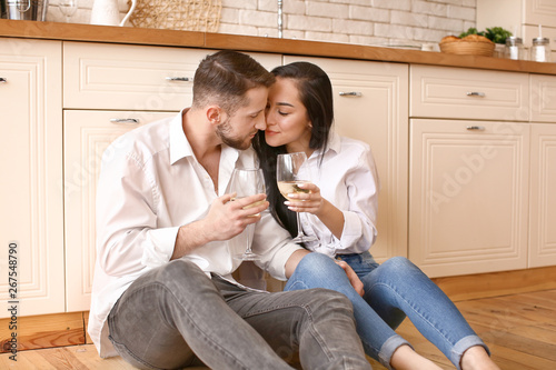 Happy young couple drinking...