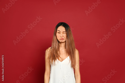Funny grimacing Asian woman...