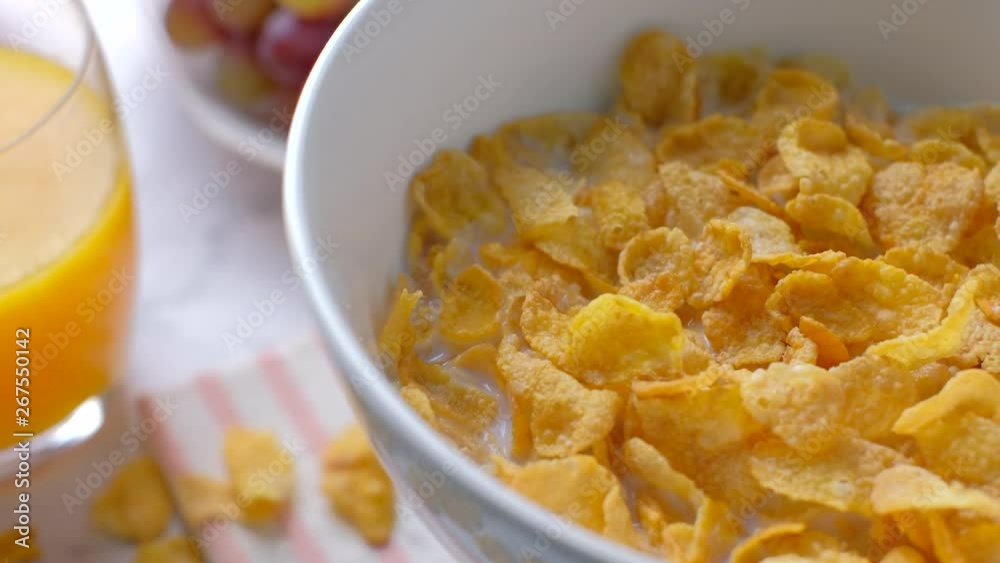 Rotating cereal in a white bowl on marble desk. Rotating cereal in a white bowl on marble desk.