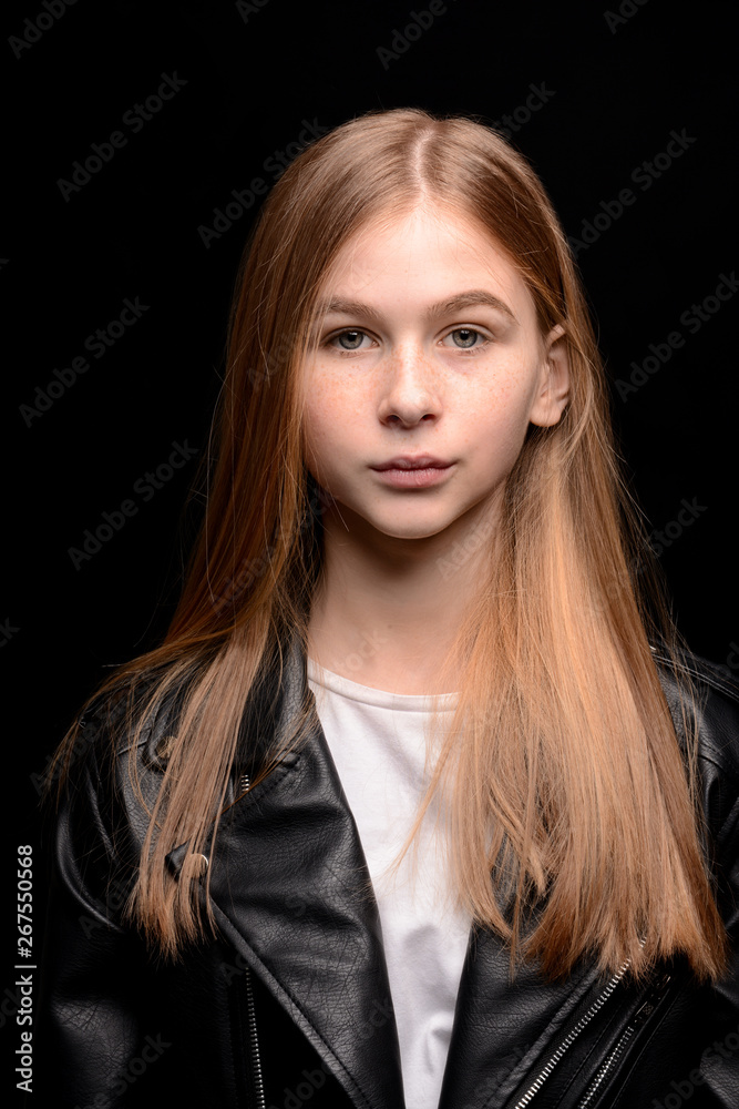Sad teenage girl on dark background Sad teenage girl on dark background