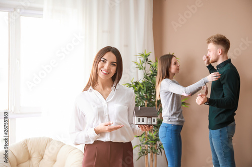 Female real estate agent wi...