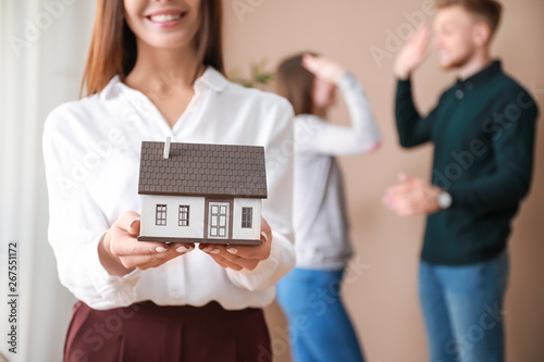 Female real estate agent wi...