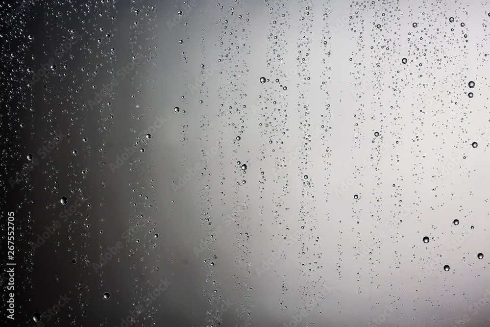 black wet background / raindrops for overlaying on window, concept of autumn weather, background of drops of water rain on glass transparent black wet background / raindrops for overlaying on window, concept of autumn weather, background of drops of water rain on glass transparent