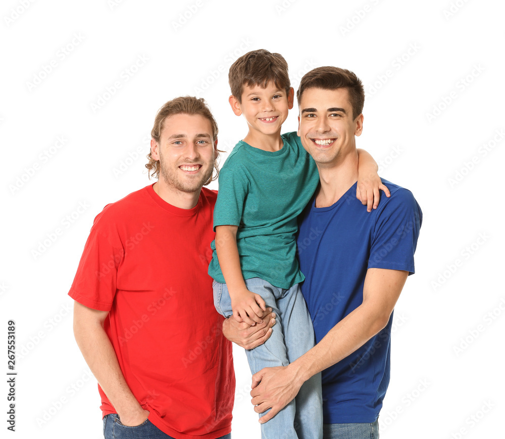 Fototapeta premium Happy gay couple with adopted child on white background
